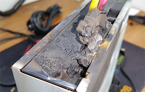 DVD drive that had caught fire inside a customers computer